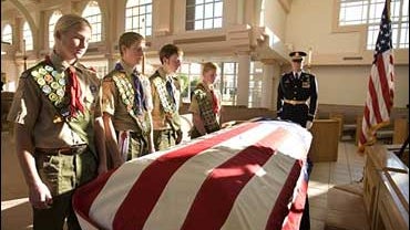 Boy Scouts from the Palm Springs, Calif. area pause at the casket of former President Gerald R. Ford 