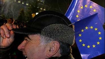 A Bulgarian holds EU flags over his hat during the celebration of the New Year and Bulgaria's joining to the European Union, in the capital Sofia, Monday, Jan. 1, 2007. Bulgaria joined the EU as a full member along with its neighbor Romania. 