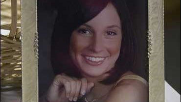 Photograph of Jodi Sanderholm sits inside the entryway to Arkansas City Dance, a dance studio where she  worked as an instructor, Tuesday night, Jan. 9, 2007, in Arkansas City, Kan. 