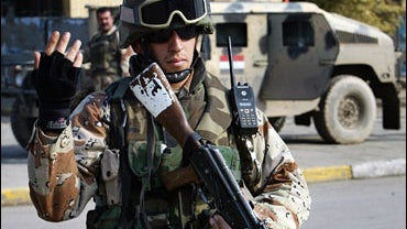 An Iraqi army soldier mans a checkpoint in central Baghdad, January 11, 2006 