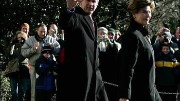President Bush and first lady Laura Bush leave the White House 