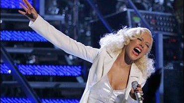 Christina Aguilera performs the song "It's a Man's World" 