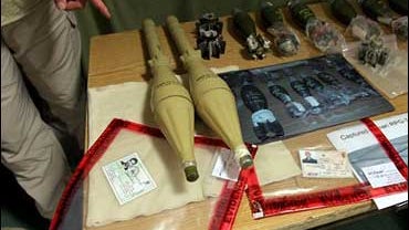 A member of the press points to a piece of evidence gathered by U.S. military on Iran's support to militant Iraqis fighting American forces. 