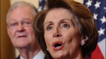 Rep. Ike Skelton, D-Mo., left, looks on as House Speaker Nancy Pelosi of Calif. discusses the House Democrats' "U. S. Troop Readiness, Veterans' Health and Iraq Accountability Act " during a news conference on Capitol Hill 