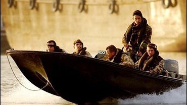British soldiers of the the 73rd Armoured Engineer Squadron, Boat Section, patrol the Shatt Al Arab waterway the outskirts of Basra, southern Iraq in this Sunday Jan. 23 2005, file photo. 