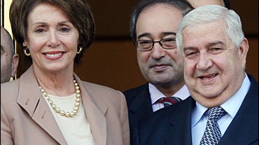 Syrian Foreign Minister Walid al-Moallem, right, stands with U.S. House Speaker Nancy Pelosi in Damascus on Wednesday, April 4, 2007 in Damascus. 