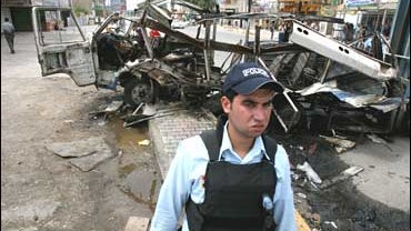 bomb, mini bus, Baghdad, Iraq, policeman 