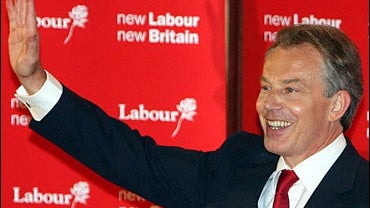 British Prime Minister Tony Blair waves to supporters at the local Labour club in Trimdon, England 
