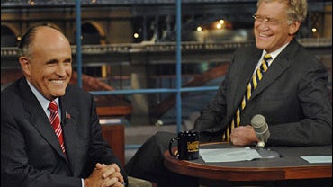 Republican presidential hopeful and former New York City Mayor Rudolph Giuliani talks to David Letterman 