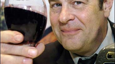 Actor Dan Aykroyd poses for photographers following a news conference in Toronto Wednesday Nov. 30, 2005. Aykroyd has invested approximately $800,000 into Niagara Cellars Inc., which owns several Ontario province wineries including Lakeview Estates, Birch 