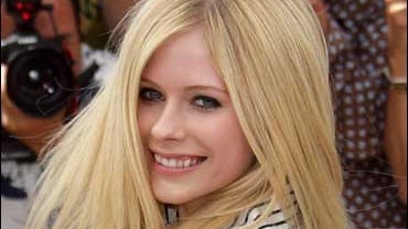Actress-musician Avril Lavigne poses during a photo call at the 59th International film festival in Cannes, southern France, on May 21, 2006. Lavigne has denied a claim by members of a 1970s rock band that her hit song "Girlfriend" rips off one of their s 
