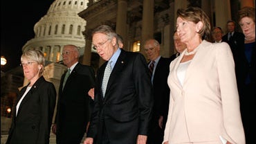 Senate Majority Leader Harry Reid (D-NV) (C) walks with U.S. Speaker of the House Rep. Nancy Pelosi (D-CA) (R) and Sen. Patty Murray (D-WA) (L) toward a rally on Capitol Hill July 17, 2007 in Washington DC. 