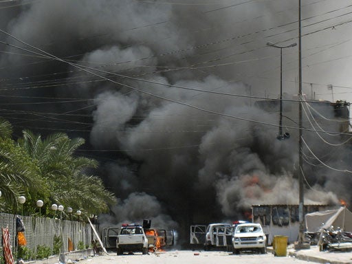 Smoke from burning cars rise after clashes broke out in the streets of Shiite holy city of Karbala 80 kilometers (50 miles) south of Baghdad, Iraq, Tuesday, Aug. 28, 2007. 