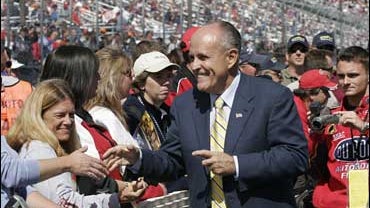 Rudy Giuliani greets NASCAR fans Sunday, Sept. 16, 2007, before the start of the NASCAR Nextel Cup Series Sylvania 300 auto race at the New Hamspshire International Speedway in Loudon, N.H. 