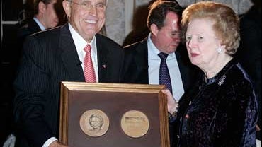Former New York Mayor Rudy Giuliani, left, poses with the former British Prime Minister Margaret Thatcher 