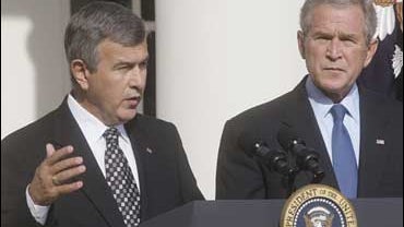 President Bush, right, listens to Agriculture Secretary Mike Johanns, left, speak in the Rose Garden after Bush announced Johanns is leaving, Thursday, Sept. 20, 2007, at the White House 