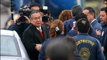 former Peruvian president Alberto Fujimori being extradited from Chile 