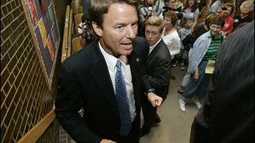 Democratic presidential hopeful, former North Carolina Sen. John Edwards, walks to a news conference after speaking about his education policy during a meeting with local residents, Friday, Sept. 21, 2007, in Des Moines, Iowa. (AP Photo/Charlie Neibergall 