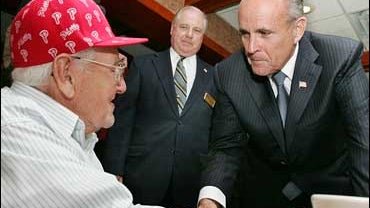 Gerald Thornton, center, looks on as Republican presidential hopeful Rudy Giuliani, right, greets 97-year-old Vince Eckerle at Dino's Seaville Diner in Dennis Township, N.J., Monday, Oct. 1, 2007. (AP Photo/Mel Evans) 
