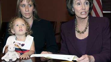 House Speaker Nancy Pelosi, right, meets with Dara Wilkerson and her daughter Bethany, 2, of Tampa, Fla., on Capitol Hill, Oct. 17, 2007. 