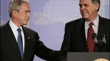 President Bush, left, is introduced by Sen. Mel Martinez, R-Fla., right, prior to a speech in support of free trade pacts in the Americas during an event sponsored by the University of Miami Center for Hemispheric Policy in Miami Friday, Oct. 12, 2007. (A 