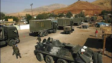 A Turkish military convoy passes through a village in the province of Sirnak, on the Turkish-Iraqi border 