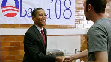 Democratic presidential hopeful Sen. Barack Obama, D-Ill., greets a supporters Wednesday, Oct. 24, 2007, as he arrives at a forum in Dover, N.H. (AP Photo/Joel Page) 