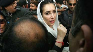Former Pakistani prime minister Benazir Bhutto surrounded by journalists at a protest by journalists in Islamabad 