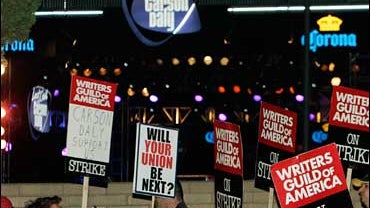 WGA pickets march and chant outside an outdoor stage where the taping of musical guest Soulja Boy for "Last Call With Carson Daly" was scheduled to occur in Burbank, Calif., Nov. 29, 2007.  The Daly show became the first late-night talk show to defy the w 
