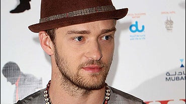 Justin Timberlake poses at a press conference 