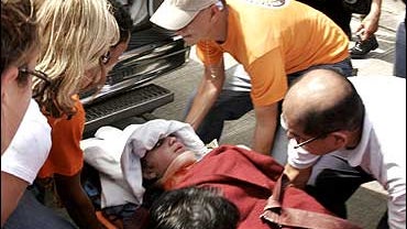 Francesca Lewis is carried on a stretcher into an ambulance after being rescued in the town of David, west of Panama City, Dec. 26, 2007. 