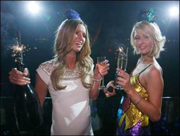 Socialites Nicky Hilton, left, and Paris Hilton attend a New Years Eve Party at LAX Nightclub in the Luxor in Las Vegas, Monday, Dec. 31, 2007. 
