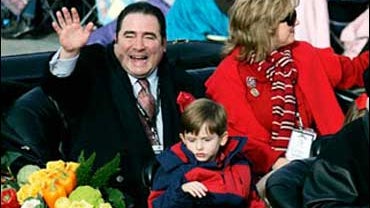 Celebrity chef and parade grand marshal Emeril Lagasse waves as he rides in the 119th Rose Parade in Pasadena, Calif., Tuesday, Jan. 1, 2008. 