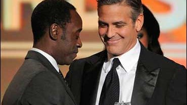 n Cheadle, left, accepts the Joel Siegel award from presenter George Clooney at the 13th annual Critics' Choice Awards on Monday, Jan. 7, 2008 in Santa Monica, Calif. 