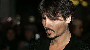 Johnny Depp poses for the photographers 