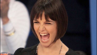 Katie Holmes holds a fake Golden Globe award 