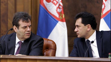 Serbian Prime Minister Vojislav Kostunica, left, speaks with Deputy Prime Minister Bozidar Djelic at the government session in Belgrade, Serbia, Tuesday, Jan. 22, 2008. 