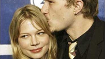 Australian actor Heath Ledger kisses girlfriend Michelle Williams during arrivals at the 15th annual Gotham Awards held in New York, Wednesday, Nov. 30, 2005. 