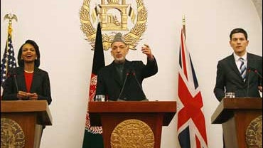Secretary of State Condoleezza Rice, Afghan President Hamid Karzai, and Britain's Foreign Secretary David Miliband 
