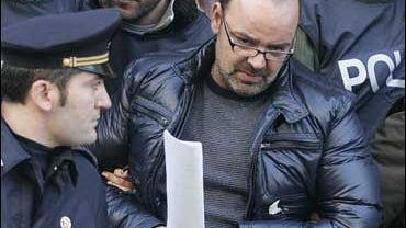 Vincenzo Licciardi is escorted by police after his arrest in Naples 