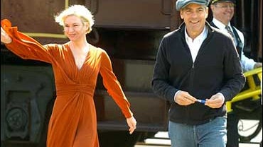 Actors Renee Zellweger and George Clooney disembark from their train to greet the crowd during a promotional tour for their new film "Leatherheads", Wednesday, March 26, 2008, in Salisbury, N.C. After greeting about 1,500 people they answered questions in 
