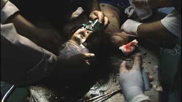 A young Iraqi boy, who was injured during clashes in the Shiite enclave of Sadr City, is treated at a hospital in Baghdad 