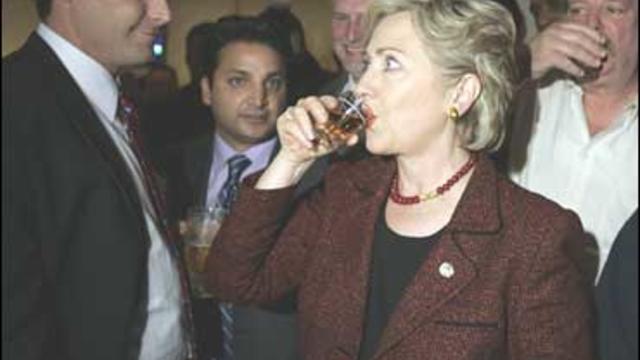 Democratic presidential hopeful Sen. Hillary Rodham Clinton, D-N.Y., sips her Crown Royal 