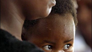 Women and children from Nyamapanda about 300 kilometres north of Harare, attend a press conference in Harare, Tuesday, April, 29, 2008. 
