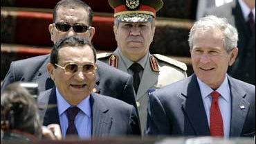 Egyptian President Hosni Mubarak accompanies U.S. President George W. Bush upon his arrival at Sharm El-Sheik airport 