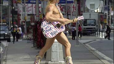 In this Sept. 10, 2002 file photo, Robert Burck, a.k.a. "The Naked Cowboy," plays his guitar in Times Square. Federal Judge Denny Chin in Manhattan on MondayJune 23, 2008 said a Times Square entertainer who wears just enough to justify the name the "Naked 