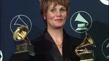 In this Feb. 25, 2008 file photo Shawn Colvin holds her two Grammy awards for Record of the Year and Song of the Year at the 40th annual Grammy Awards at New York's Radio City Music Hall. Colvin is working on a memoir, "A Few Small Repairs," named for her 