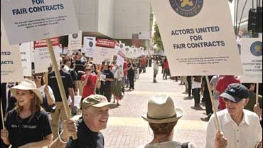 Members of the Screen Actors Guild, and their supporters, rally outside the organization's headquarters 