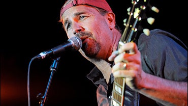 Kevin Costner, star of "Swing Vote," performs with his band at the post-premiere party for the film in Los Angeles, Thursday, July 24, 2008. (AP Photo/Chris Pizzello) 