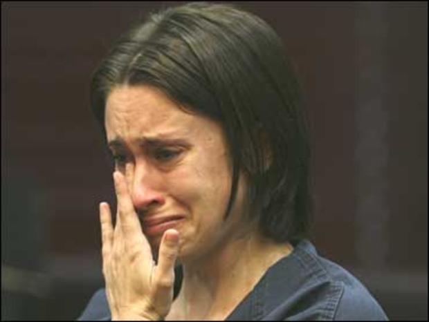Casey Anthony wipes tears from her eyes at a bond hearing at the Orange County courthouse in Orlando, Fla. 